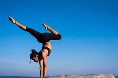 girl-doing-upside-down-yoga-pose